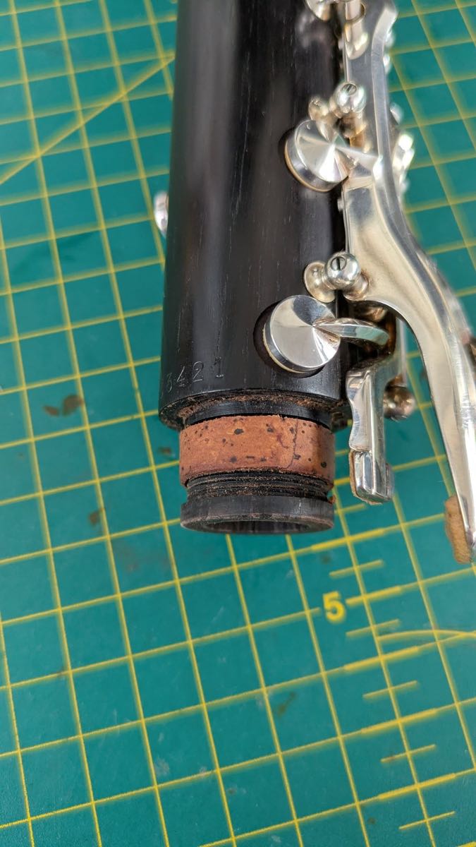 Worn and cracked clarinet tenon cork before repair